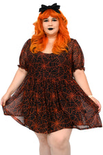 Black sheer mesh dress with custom orange spiderwebs