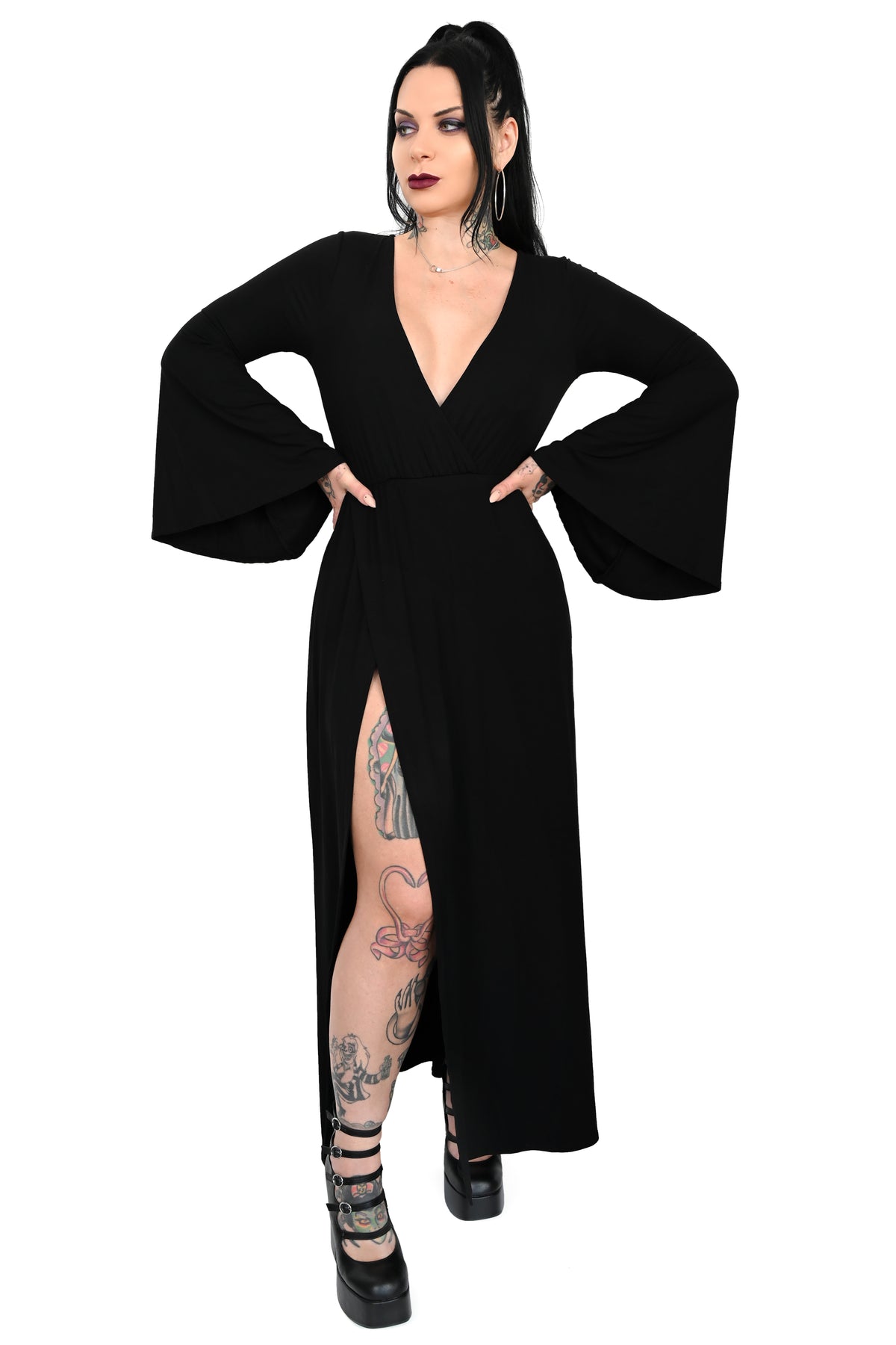 Dramatic bell sleeve wrap top with deep cut V-neck line.  Long skirt bottom with one sky high sexy side slit.  It has a built in full backside bodysuit bottom with snap crotch to keep the dress in place. 