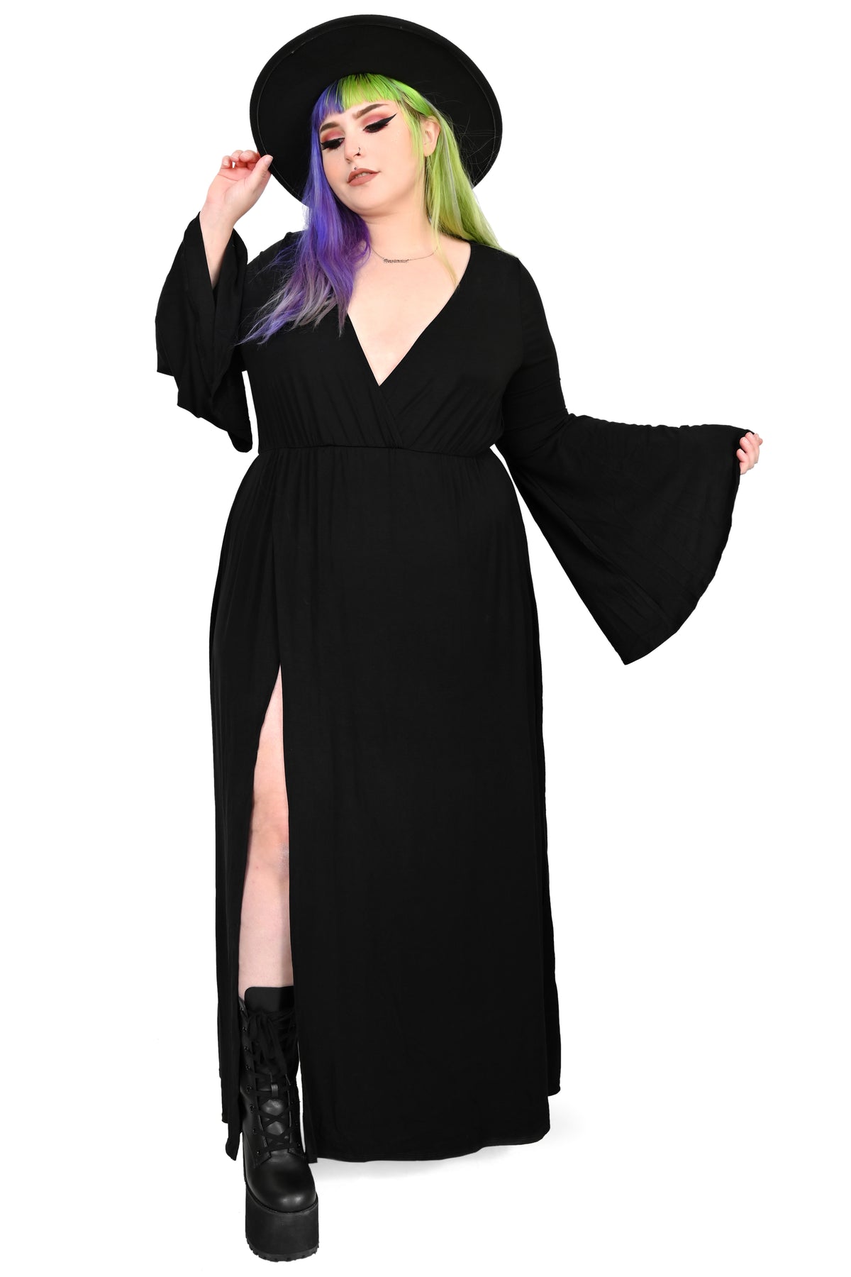 Dramatic bell sleeve wrap top with deep cut V-neck line. Long skirt bottom with one sky high sexy side slit. It has a built in full backside bodysuit bottom with snap crotch to keep the dress in place.