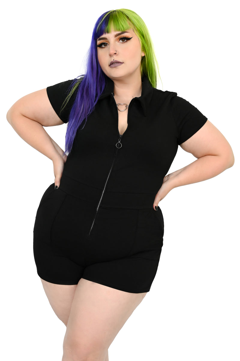 Zip up romper with deep front pockets and pointed collar.