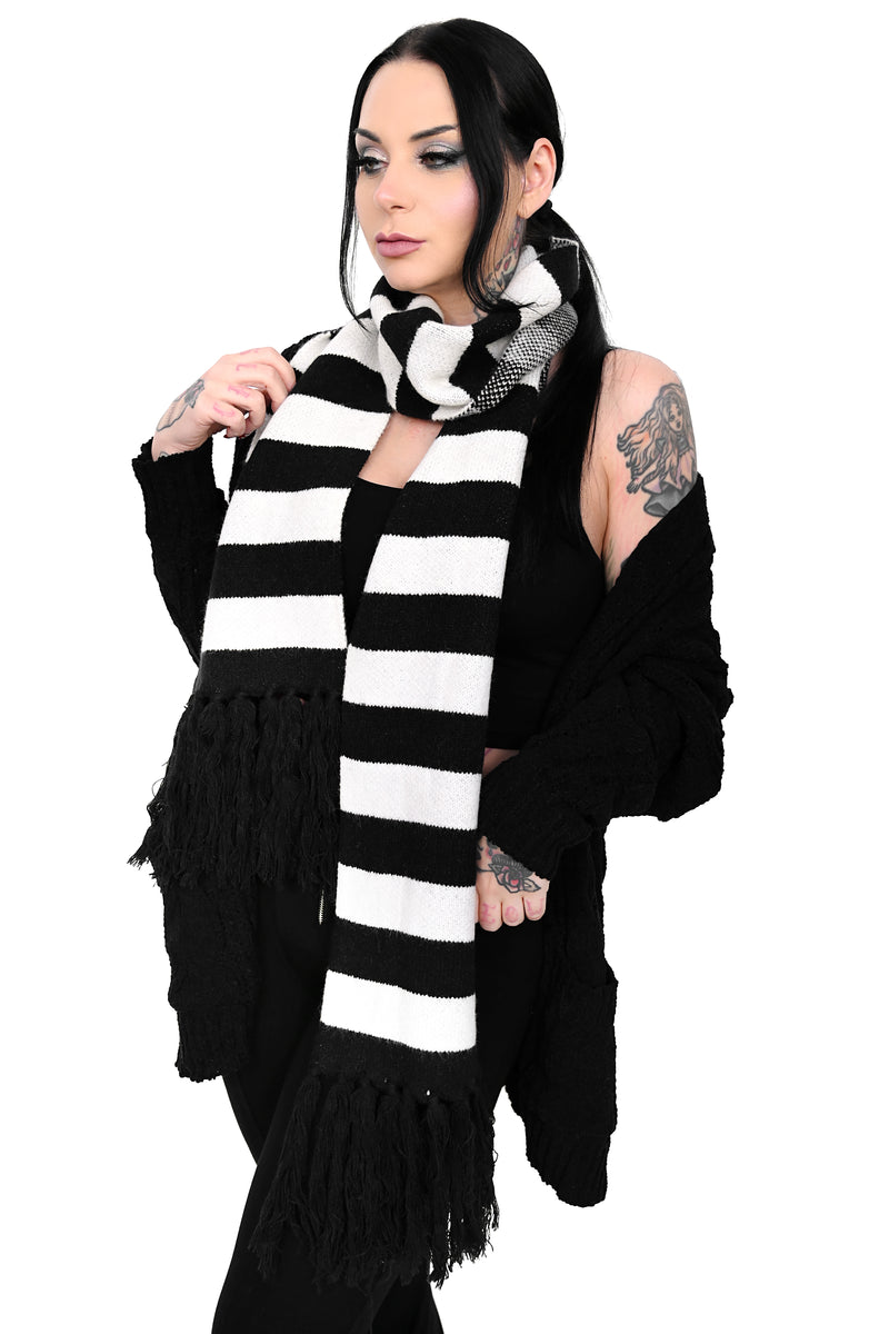 Soft black and white scarf with fringe ends.