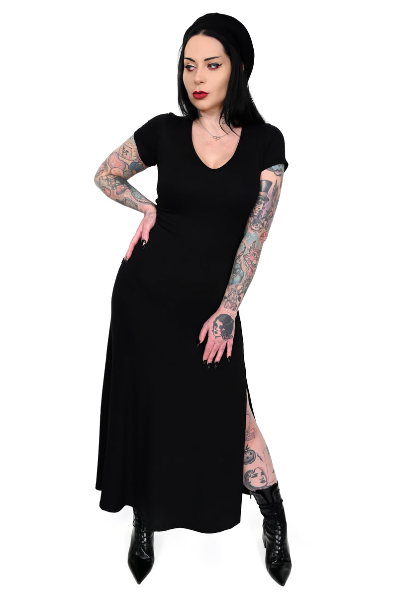This black maxi dress features a V-cut neckline, and a side slit for easy movement.