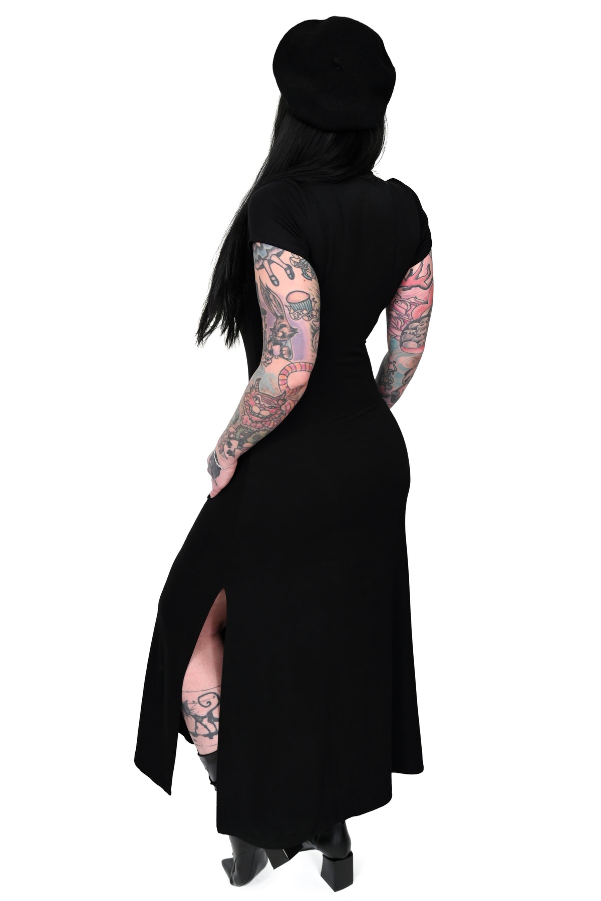This black maxi dress features a V-cut neckline, and a side slit for easy movement. 