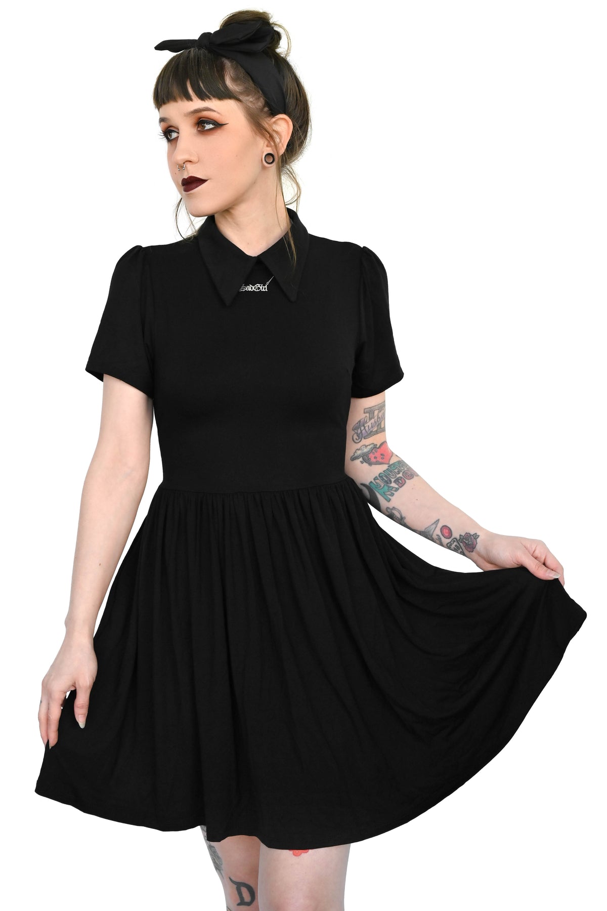 Black collared swing dress with pockets and tie back