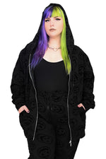 Flocked scary jack faces all over a black zip up hoodie