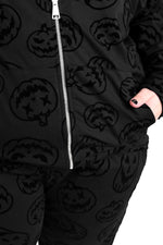 flocked jackolantern face pattern on a matching zip up hoodie and jogger set