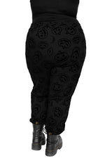 Flocked scary jack faces all over black joggers with an elastic waist