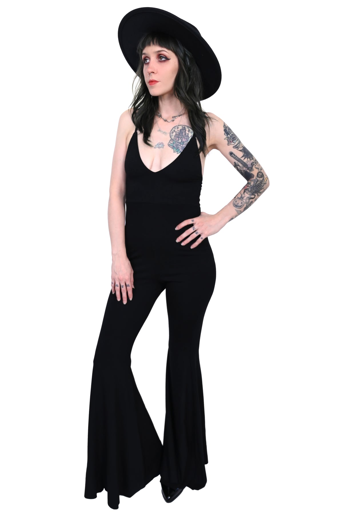 This jumpsuit has a deep plunging neckline and the ultimate flared bell bottoms with adjustable straps