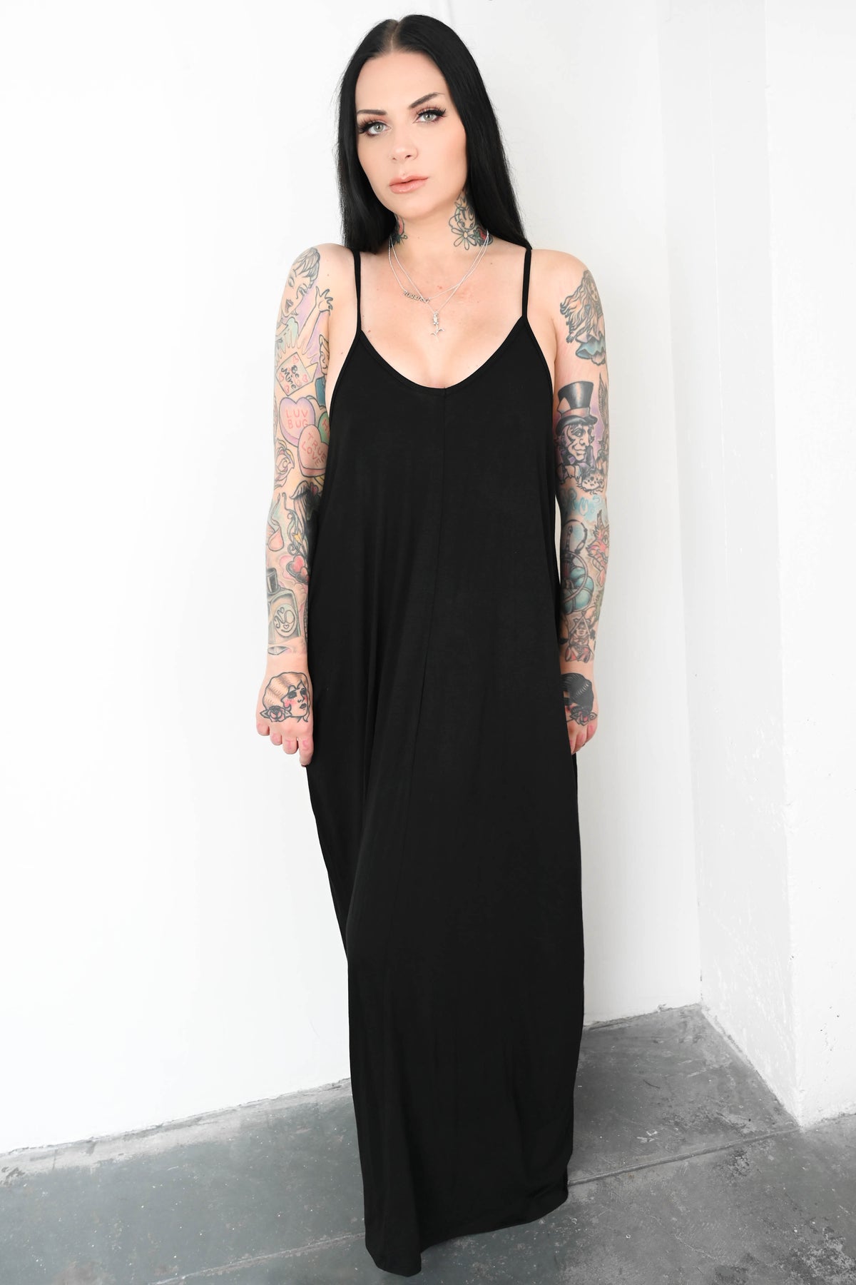 black maxi dress with thin shoulder straps and pockets 