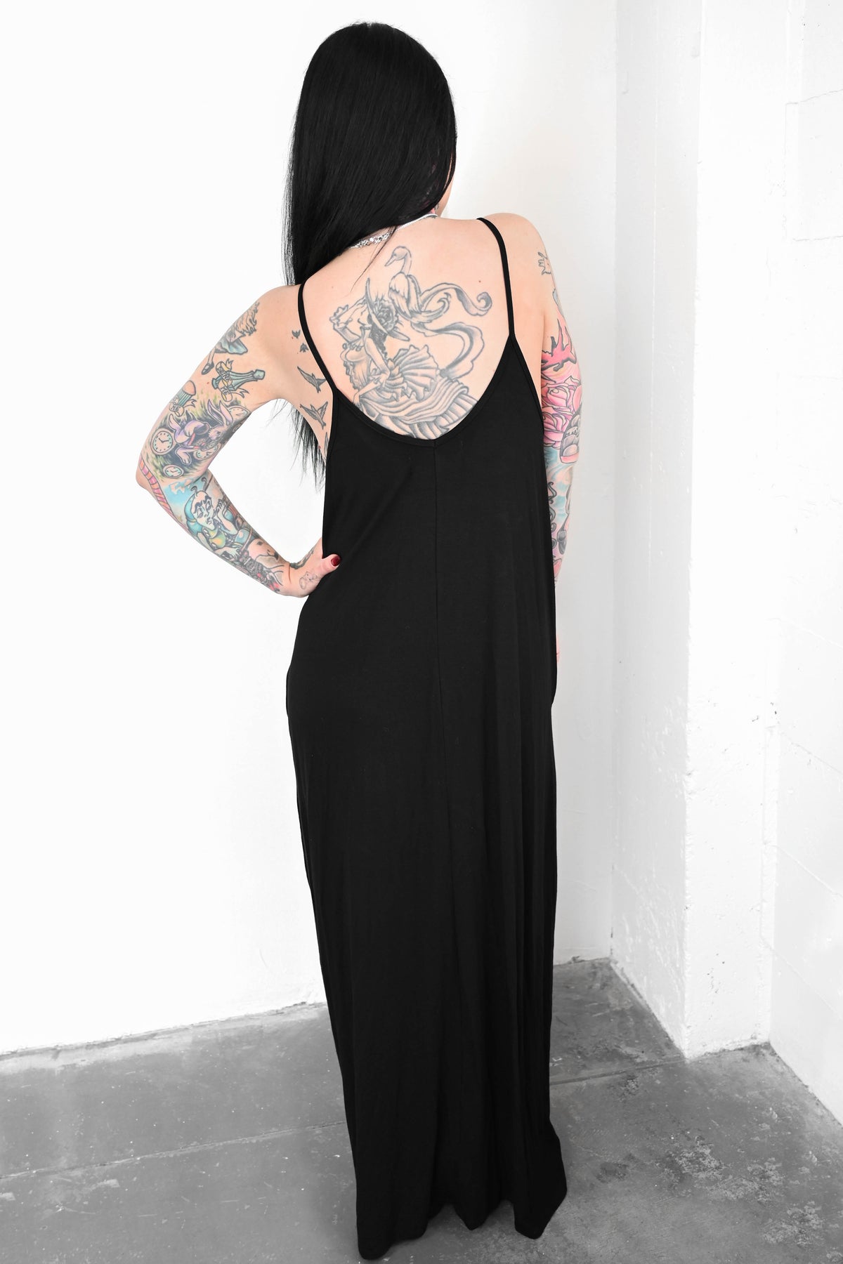 black maxi dress with thin shoulder straps and scooped back 