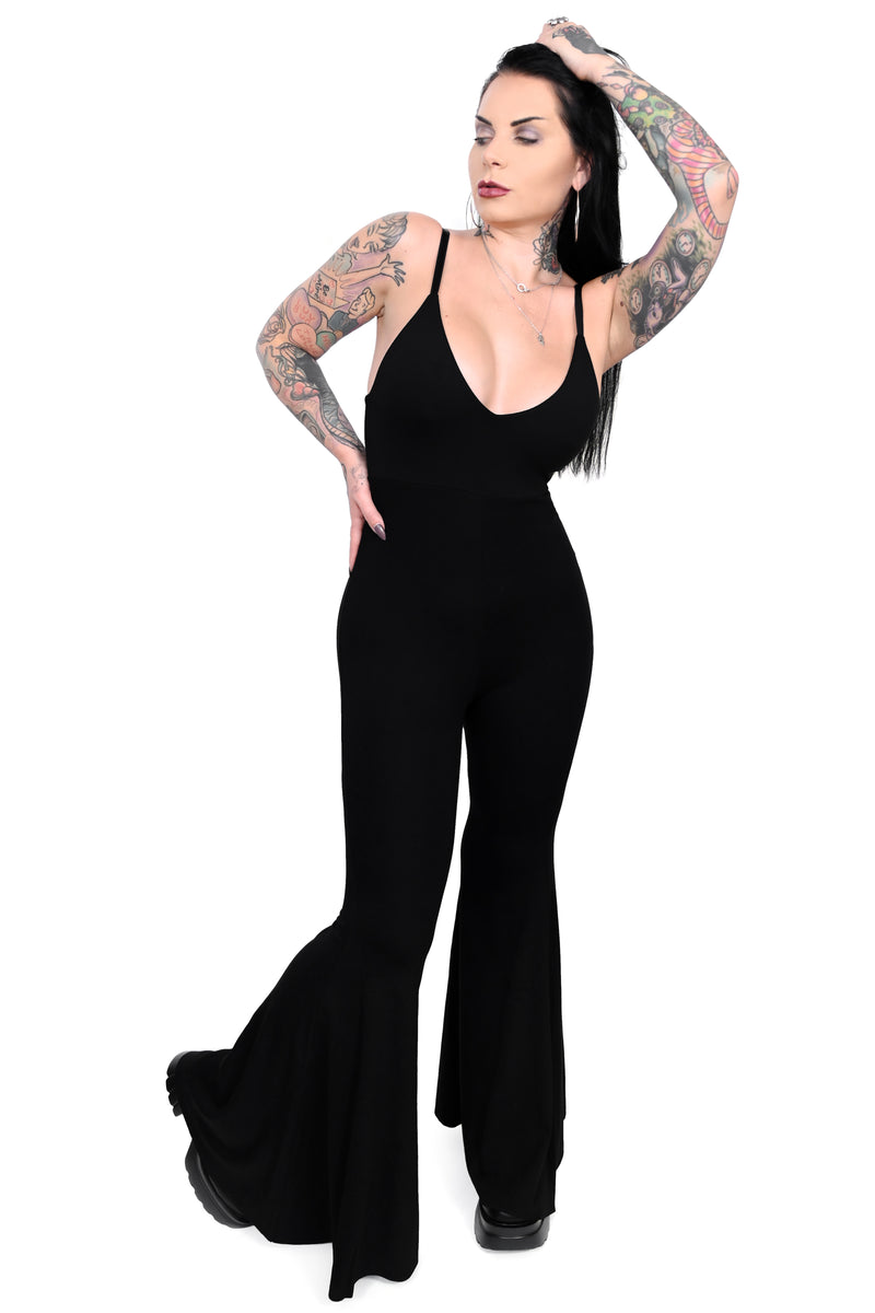 This jumpsuit has a deep plunging neckline and the ultimate flared bell bottoms with adjustable straps