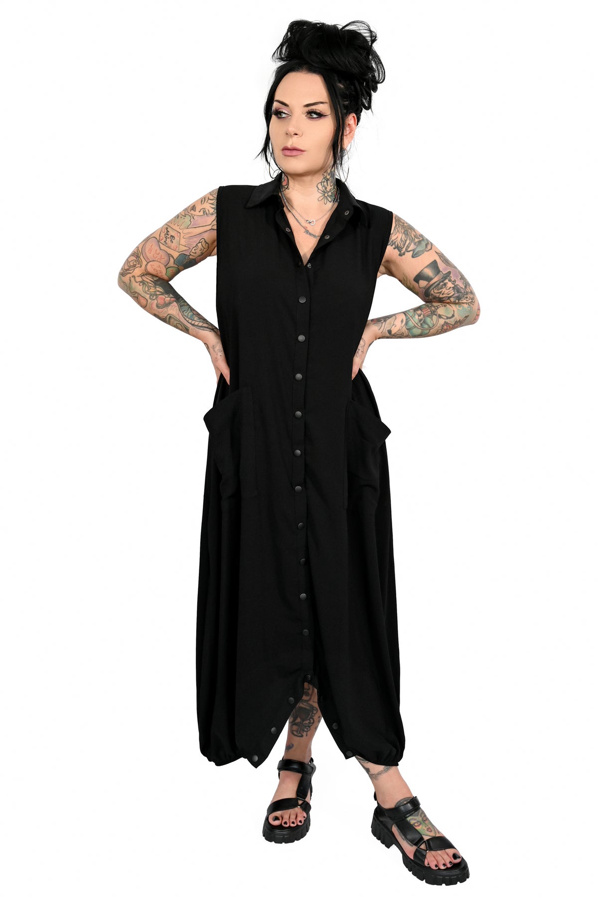 Button down jumpsuit with snaps and front pockets. unbutton the bottom to wear as a flowing maxi!