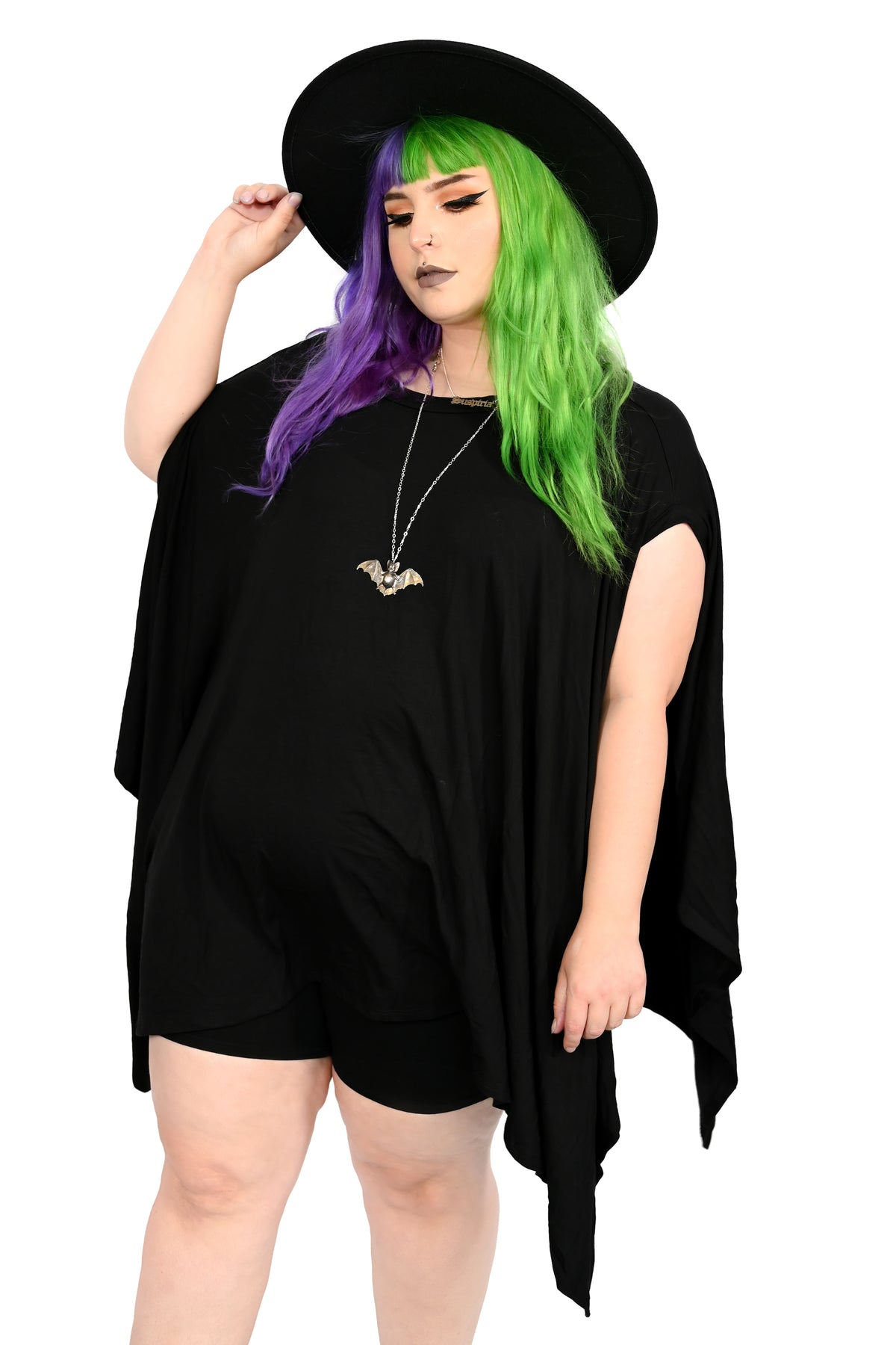 Super soft and stretchy cotton modal black tunic with draping fabric where sleeves would be