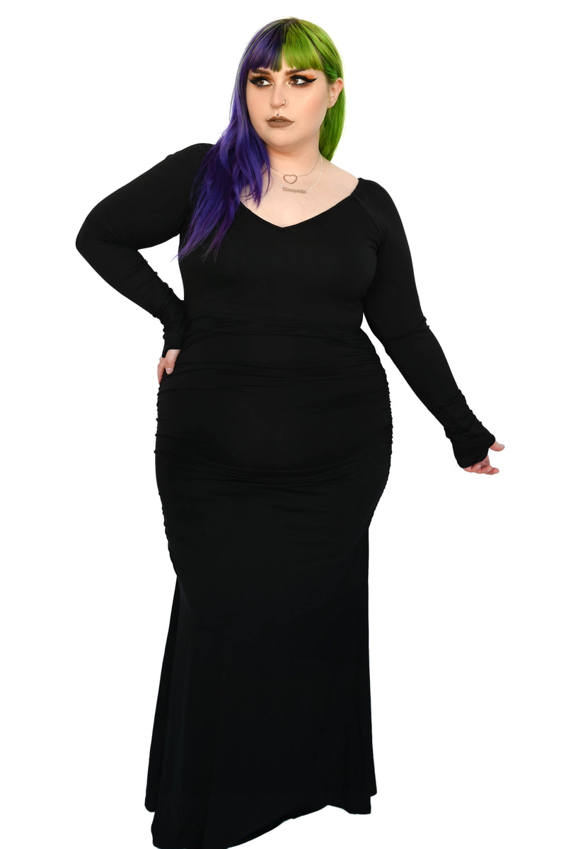 black, long sleeve maxi skirt with thumb holes and a flared skirt