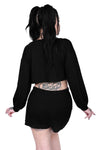 oversized crop bishop sleeve top and loose shorts with an elastic waist.