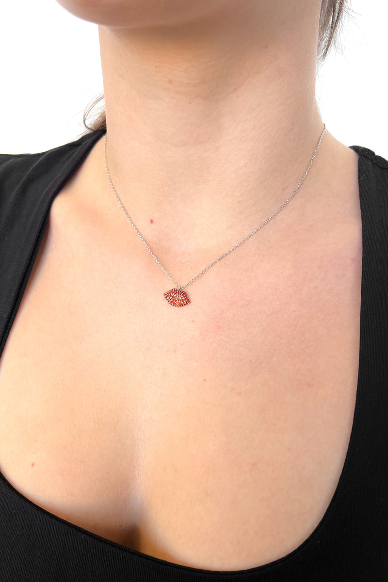 Silver circle studded red lips necklace on a tiny chain