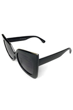 Black lucite sunglasses with gold edge detail and black lenses