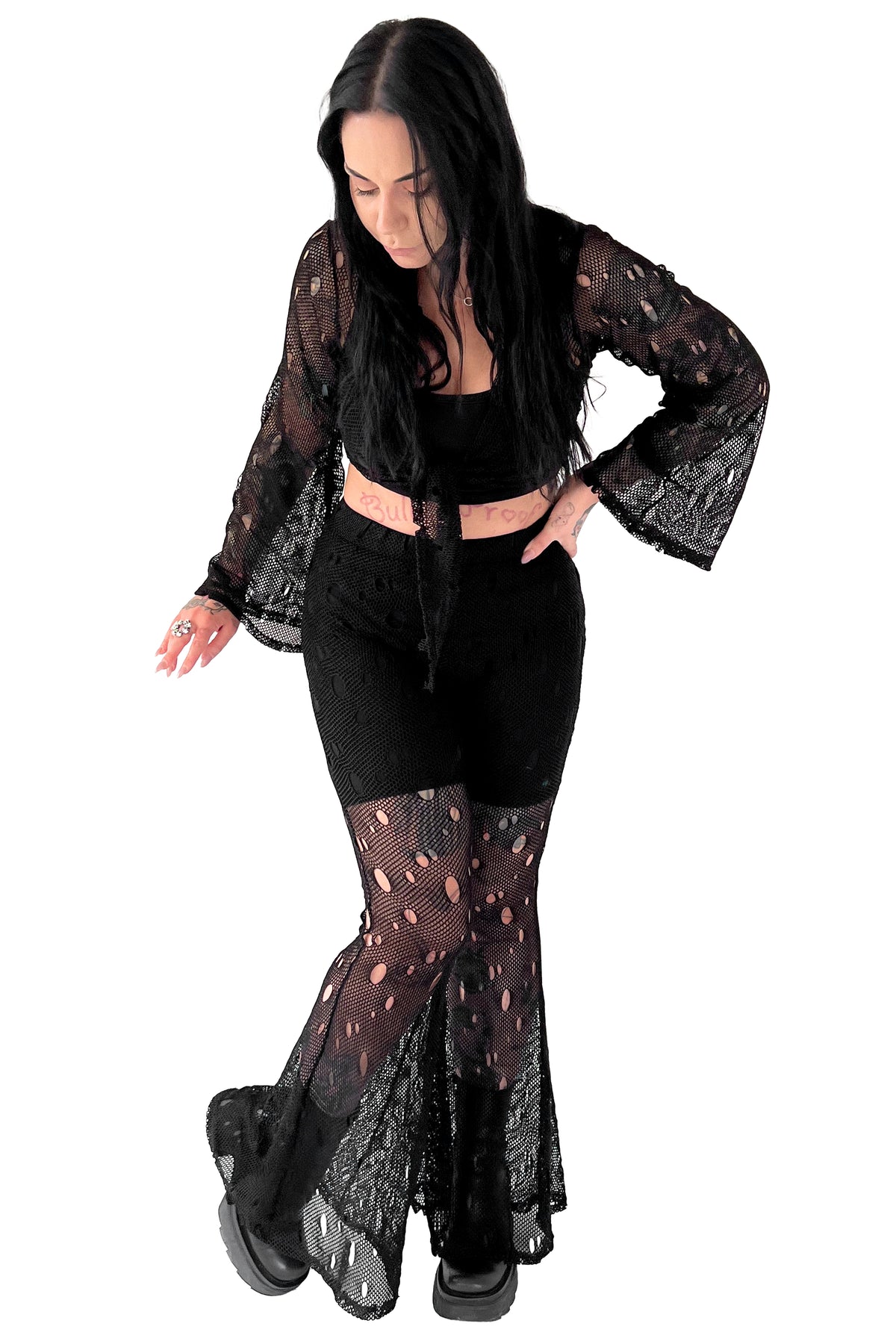 2 piece fishnet set made of a soft stretch black fishnet material. Tie front top, with loose fit bell sleeves. Elastic waist high waisted bell bottoms.