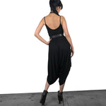 black oversized drop crotch jumpsuit with thin shoulder straps and scooped back 